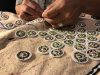 Wyoming-Artist Colleen Friday working on an elk hide art piece